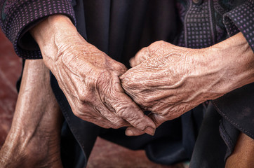 Dramatic hands of an old unidentified Person