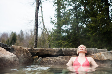 Young Woman Relaxing in a Nordic Spa