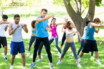 Fototapeta premium Friends exercising in park