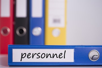 Personnel on blue business binder