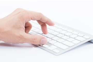 Man hand typing on keyboard