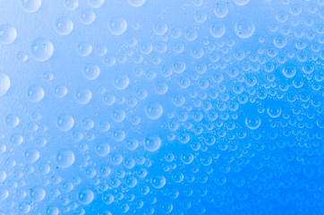 Water drop on color background