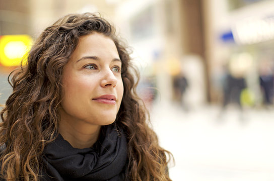 Portrait Of Attractive Young Woman Gazing Positively