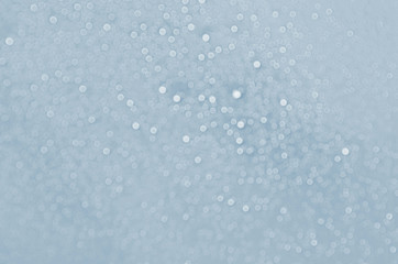 Decorative defocused water drops on blue background