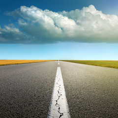 Driving on an empty asphalt road through the agricultural fields © rasica