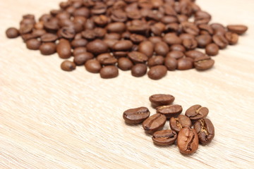 Heap of coffee on wooden background