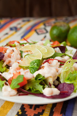 salad with prawns lime tomato lettuce arugula