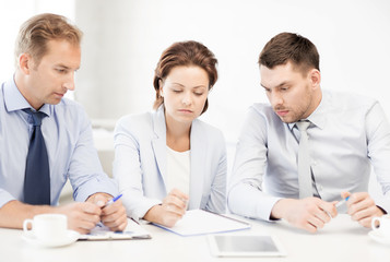 business team discussing something in office