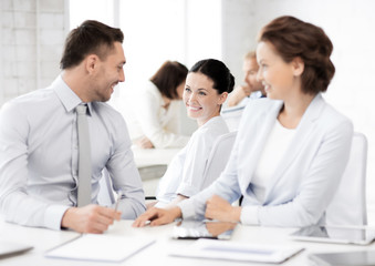 business team discussing something in office