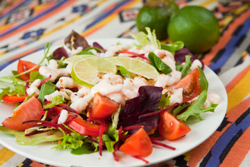 salad with prawns lime tomato lettuce arugula - obrazy, fototapety, plakaty