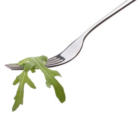 Fototapeta na wymiar Fresh rucola salad on fork isolated on white background cutout.