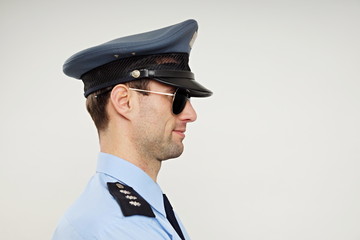 Profile of handsome policeman in sunglasses