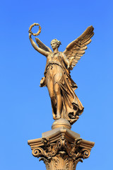 Fototapeta na wymiar Golden Angel in front of House of Artists, Prague