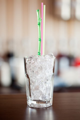 glass of cola with ice on the bar
