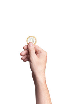 Condom in hand, isolated on white background