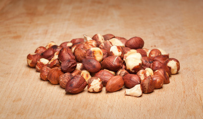 Hazelnuts on wooden background