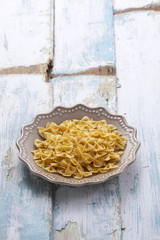 yellow spaghetti in studio light