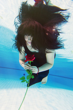 Beautiful young Asian woman  under the water