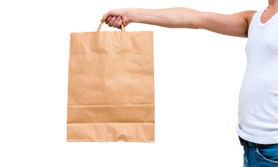 Man in undershirt holding a paper bag