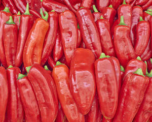 colorful red bell peppers for sale, natural background