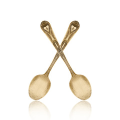 old brass spoon isolated on white background