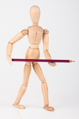 Small wood mannequin standing with colour pencil isolated on whi