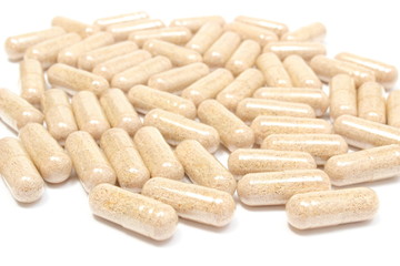 Heap of medicine pills on white background