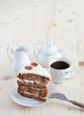 A single piece of Hummingbird cake with pecans and cream cheese
