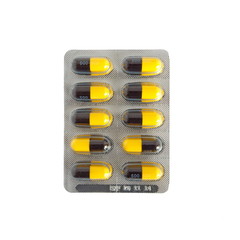 Capsules and pills packed on white background