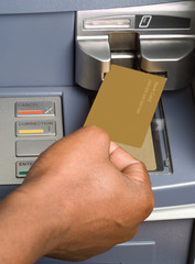 South African or African American drawing cash money at ATM