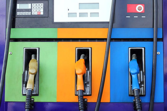 gas pump nozzles on service station