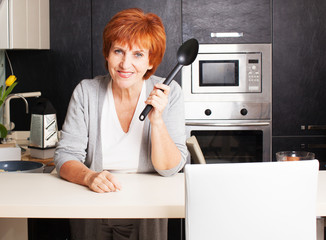 Fototapeta na wymiar Woman at kitchen