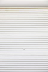 Fototapeta premium background of white grunge metallic roller shutter door