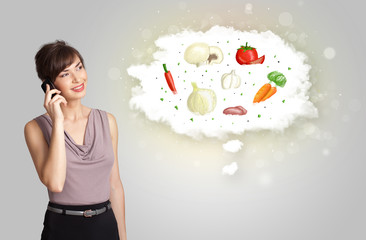 Pretty woman presenting a cloud of healthy nutritional vegetable