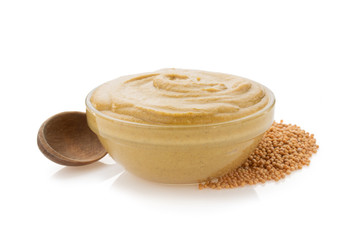 mustard sauce in bowl on white