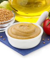 mustard sauce in bowl on white