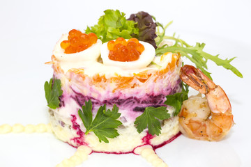herring salad vegetables mayonnaise on a table in a restaurant