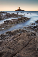 Long exposure seascape of rocky coastline on tower island