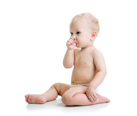Baby boy suckling thumb isolated on white