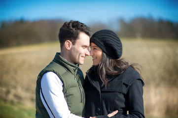 Happy love couple hugging each other outside in spring season