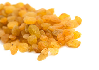 Golden raisins on a white background