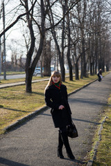 Young beautiful girl on a walk in the country