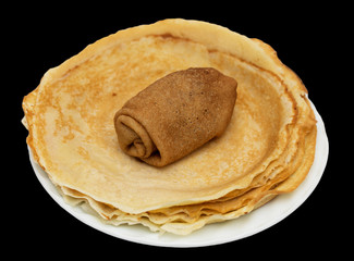 Russian pancakes on a black background