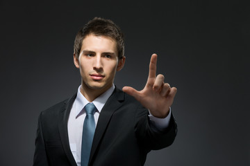 Half-length portrait of manager forefinger gesturing