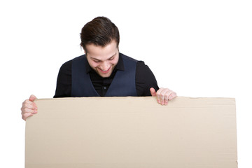 Man looking down on blank poster