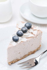 blueberry and coconut cheesecake on a plate