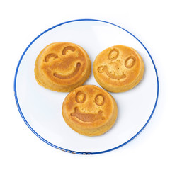 Obraz na płótnie Canvas smiling tasty corn pancake, top view, isolated