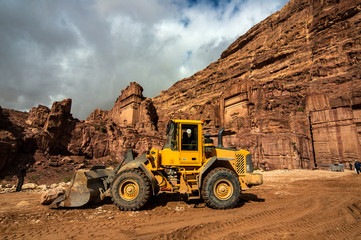 Modern machinery at Petra historical site.