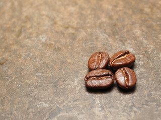 Roasted Coffee beans on texture floor