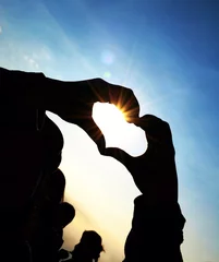 Foto op Plexiglas silhouette picture of hands in heart shape © himawari_dew